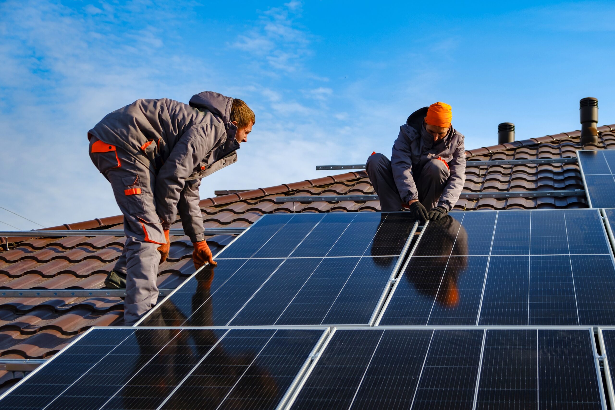 Installing,A,Solar,Cell,On,A,Roof.,Solar,Panels,On